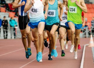 Rise Nutrition enhances athletes’ performances with platform Group of male athletes running in a group round a track.