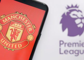 Manchester United unveils Snapdragon as 2024/25 kit sponsor Manchester United on a mobile phone in front of Premier League logo.