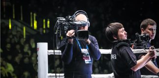 Boxxer brings its events to Sub-Saharan Africa with new deal Man holding camera in boxing ring.