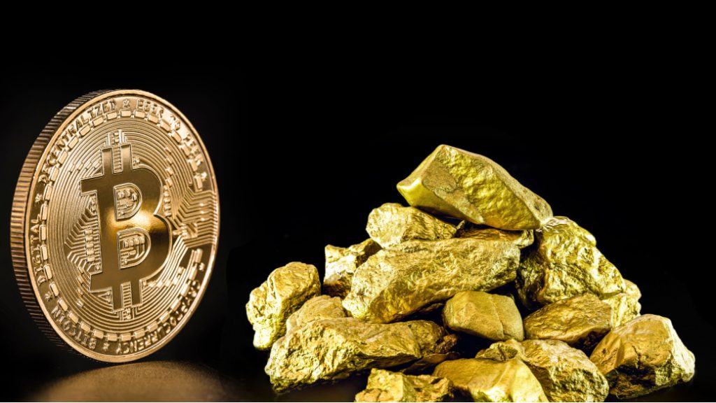 Bit coin sat next to a pile of gold.