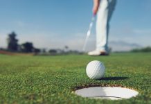 New Zealand Open tees up excitement with TAB partnership Man putting a golf ball into the hole.