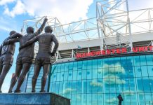 Manchester United & Stone Roses fuses fashion with football The trinity statue outside of Old Trafford.