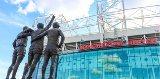 Manchester United & Stone Roses fuses fashion with football The trinity statue outside of Old Trafford.