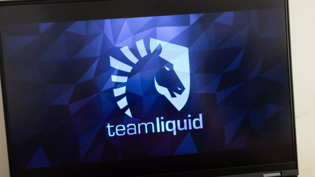 Team Liquid badge on a laptop screen.