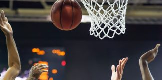 NBA and Sportradar create hyper-personalised viewing experiences Basketball ball, in the background information board.