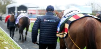 BoyleSports elevates Irish Grand National with increased prize pot Man leading out a horse before a race.