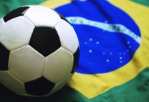 CBF reaffirms stance of “zero tolerance” with Siga partnership Football sitting on Brazilian flag background.