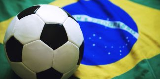 CBF reaffirms stance of “zero tolerance” with Siga partnership Football sitting on Brazilian flag background.
