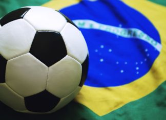 CBF reaffirms stance of “zero tolerance” with Siga partnership Football sitting on Brazilian flag background.