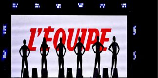 L’Equipe is set for global expansion with IMG partnership Six silhouettes stood in front of white screen that reads "L'Equipe" in red lettering.