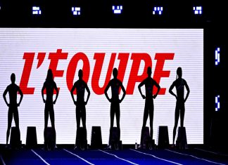 L’Equipe is set for global expansion with IMG partnership Six silhouettes stood in front of white screen that reads "L'Equipe" in red lettering.