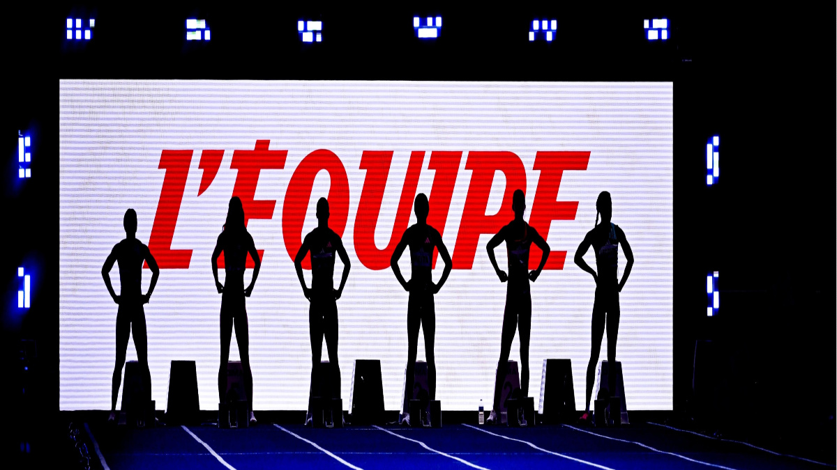 Six silhouettes stood in front of white screen that reads "L'Equipe" in red lettering.