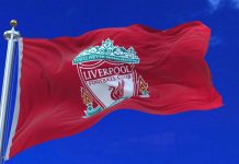Liverpool pursues multi-club model with Edwards appointment Liverpool F.C. flag waving with the clouds background.