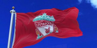 Liverpool pursues multi-club model with Edwards appointment Liverpool F.C. flag waving with the clouds background.