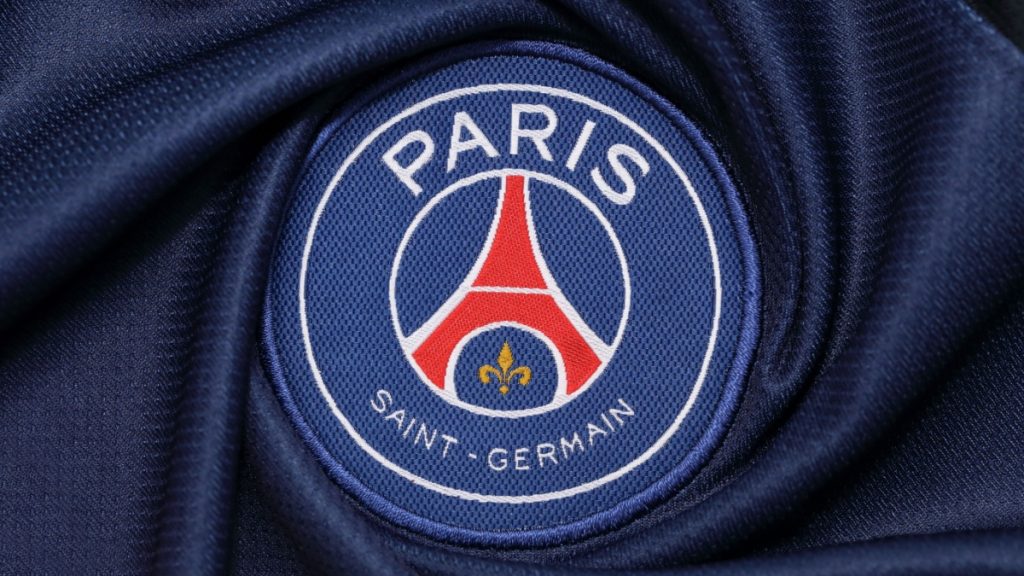 the logo of Paris Saint Germain football club on an official jersey.