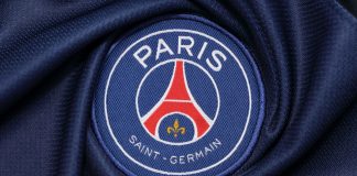 PSG and SNIPES partner to ‘give back to the community’ the logo of Paris Saint Germain football club on an official jersey.