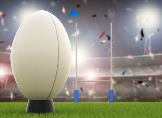 WRU issues Wales Women’s rugby team with 37 full-time contracts 3D rendering rugby ball with rugby posts on field.