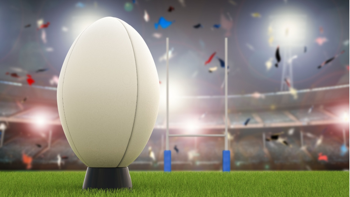 3D rendering rugby ball with rugby posts on field.