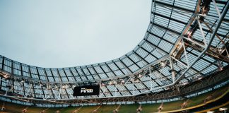 bwin champions volunteers with UEFA opportunity Aviva Stadium in Dublin with digital screen showcasing bwin Fan Final.