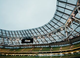 bwin champions volunteers with UEFA opportunity Aviva Stadium in Dublin with digital screen showcasing bwin Fan Final.