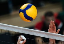 Volleyball championship expected to boost Philippine tourism Volleyball action. Ball above net during volleyball game.