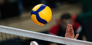 Volleyball championship expected to boost Philippine tourism Volleyball action. Ball above net during volleyball game.