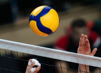 Volleyball championship expected to boost Philippine tourism Volleyball action. Ball above net during volleyball game.