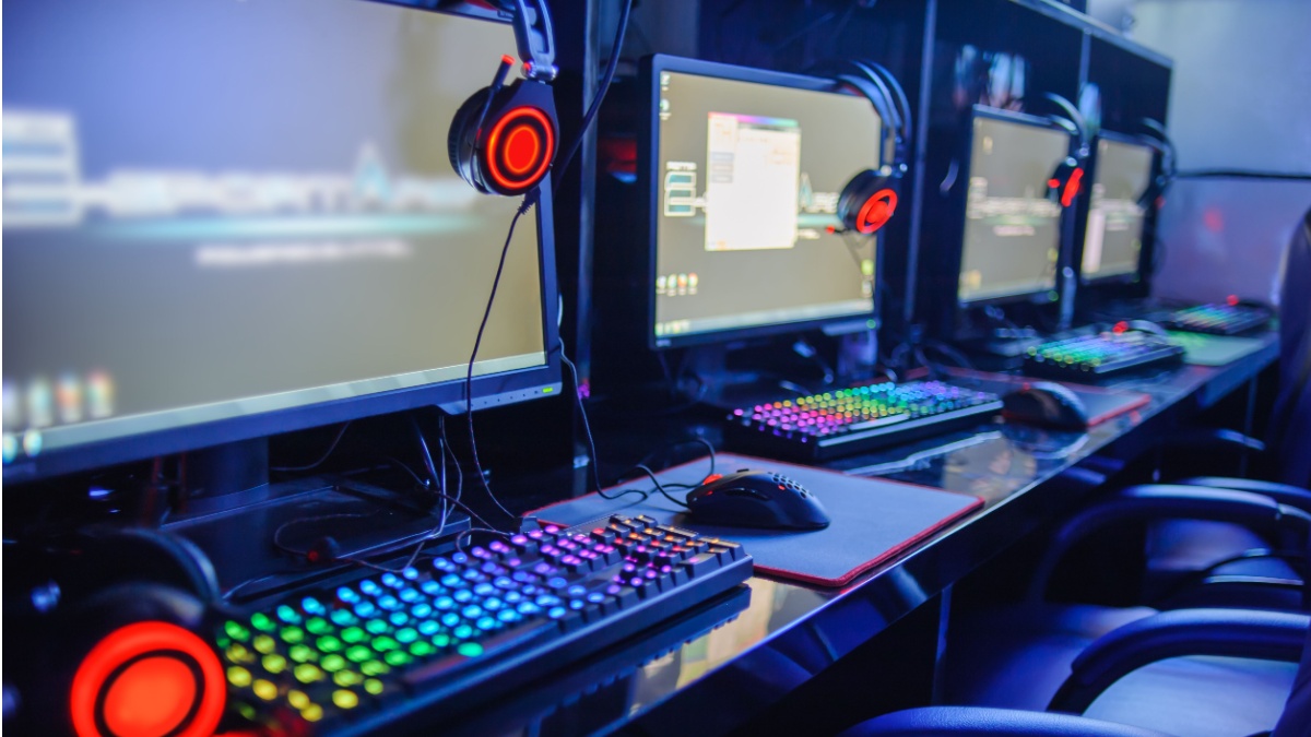 Gamer computer on line in internet cafe.