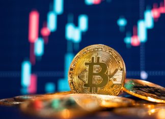 Ninth tier club eyes up Premier League after $4.5m bitcoin investment Bitcoin gold coin and defocused chart background.