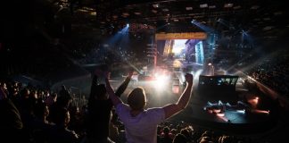 Team Vitality leverages Abios’ tech to drive fan engagement Counter Strike: Global Offensive cyber sport event. Main venue and fan of one of the teams in front.