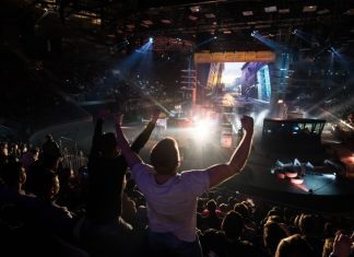 Team Vitality leverages Abios’ tech to drive fan engagement Counter Strike: Global Offensive cyber sport event. Main venue and fan of one of the teams in front.