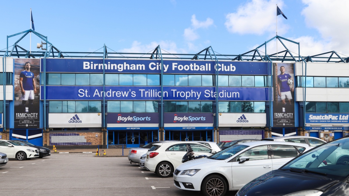 Parked cars outside St Andrews Trillion Trophy Stadium in Birmingham, England.