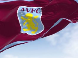 Aston Villa’s £20m Visit Rwanda deal draws sportswashing warning The flag of Aston Villa Football Club waving in the wind on a clear day.