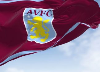 Aston Villa selects Adidas ahead of Champions League debut The flag of Aston Villa Football Club waving in the wind on a clear day.