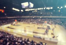 Report: WME divests basketball division with baseball to follow Defocused background of crowd of people in a basketball court