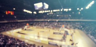 Report: WME divests basketball division with baseball to follow Defocused background of crowd of people in a basketball court