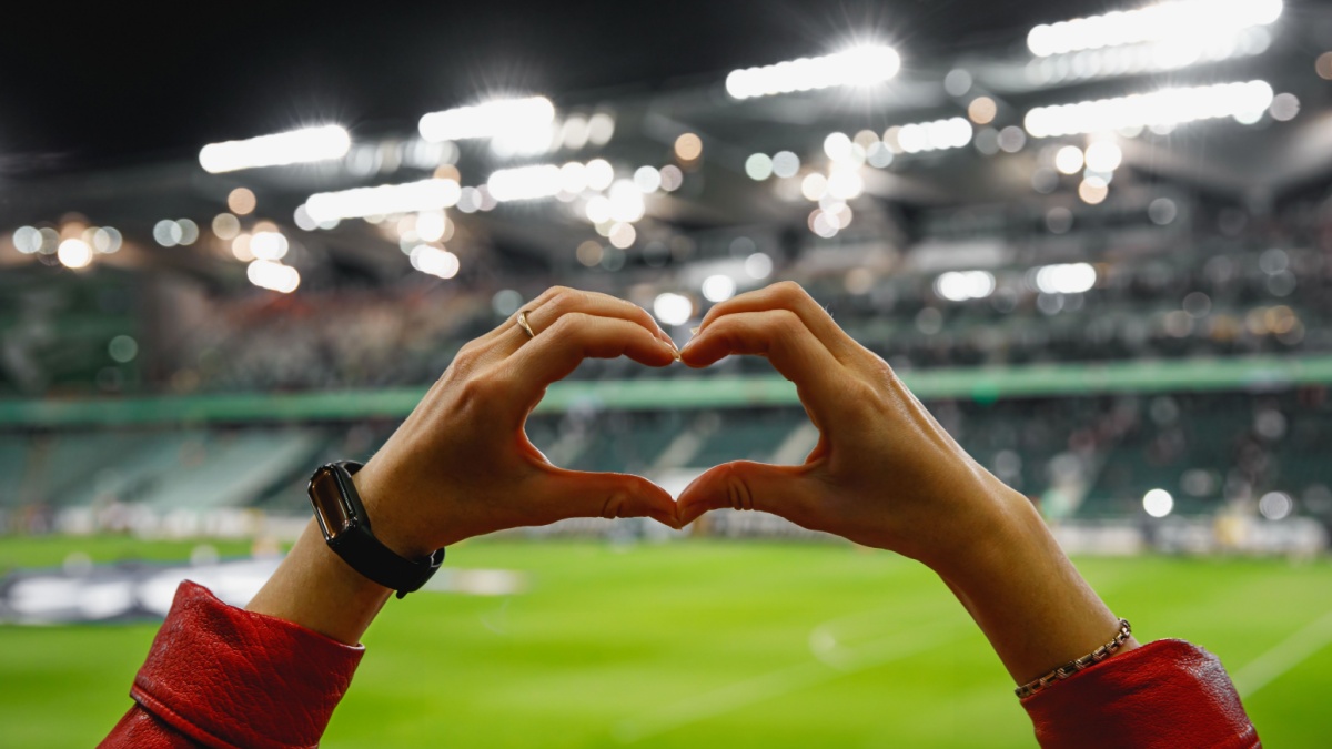 Heart shape for the favorite football club during a match in a stadium.