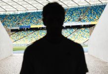 Matchday Programme – Alan Casey: Trophy droughts and dreams fulfilled Silhouette of a man walking throught the stadium entrance.