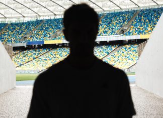 Matchday Programme – Ben Leanse: Ronaldo’s conqueror mentality Silhouette of a man walking throught the stadium entrance.