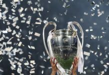 UEFA marks new era of European football with Mastercard deal Champions League cup in the hands of the winner, confetti on the background. UEFA Champions League final between Real Madrid and Liverpool. NSC Olympic stadium in Kyiv.