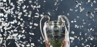 UEFA marks new era of European football with Mastercard deal Champions League cup in the hands of the winner, confetti on the background. UEFA Champions League final between Real Madrid and Liverpool. NSC Olympic stadium in Kyiv.