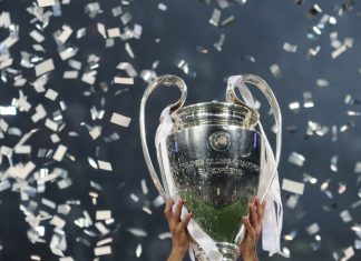 Adidas to supply Champions League balls for three more years Champions League cup in the hands of the winner, confetti on the background. UEFA Champions League final between Real Madrid and Liverpool. NSC Olympic stadium in Kyiv.