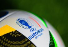 Research finds consumer disconnect for Euro 2024 sponsors Logo of Euro 2024 in Germany. Detail at Official Adidas soccer ball Fussballliebe for Euro 2024 placed on green grass.