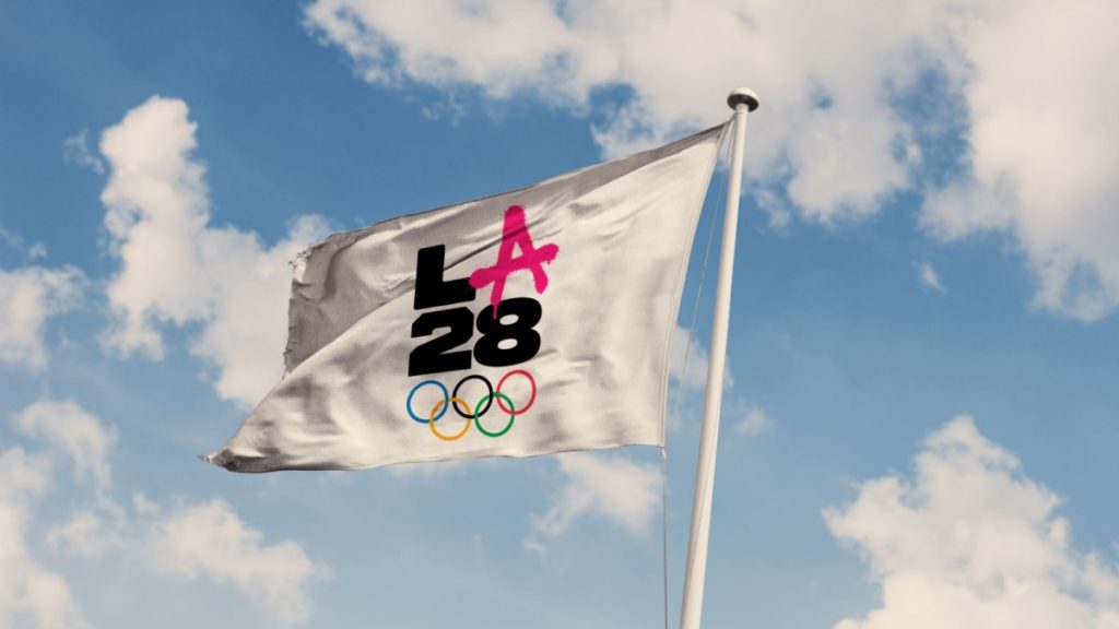 A photo illustration of the LA28 Summer Olympic Games logo on a flag.