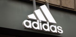 Adidas links athletics to digital in EWCF partnership Adidas logo on Adidas store.