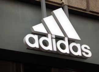 Adidas links athletics to digital in EWCF partnership Adidas logo on Adidas store.