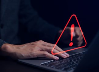 IBIA: Esports contributes to half of 90 betting alerts for Q2 Businessman working on the computer. Warning alert system concept, hacked on the computer network, crime and virus, Malicious software, compromised information, illegal connection, data vulnerability.