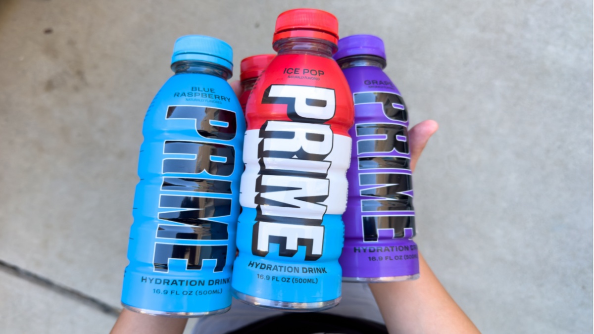 Handful of Prime drink bottles, including popular flavours, blue raspberry and ice pop.
