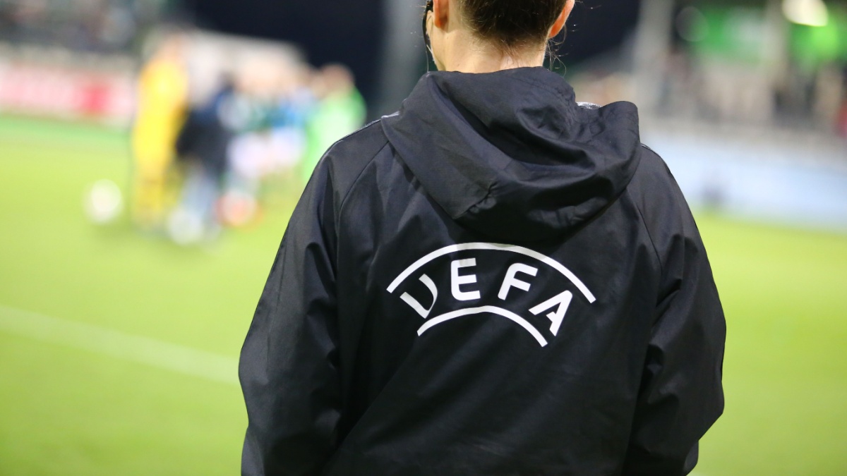 official UEFA assistant referee during UEFA Champions League game at AOK Stadion