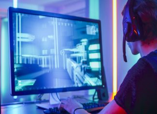 Navi joins forces with Visa to create CS2 esports pathway Shot of the Professional Gamer Playing in First-Person Shooter Online Video Game on His Personal Computer. Room Lit by Neon Lights in Retro Arcade Style. Online Cyber e-Sport Internet Championship.